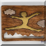 J074. Brass and wood leaping woman pin. - $32 